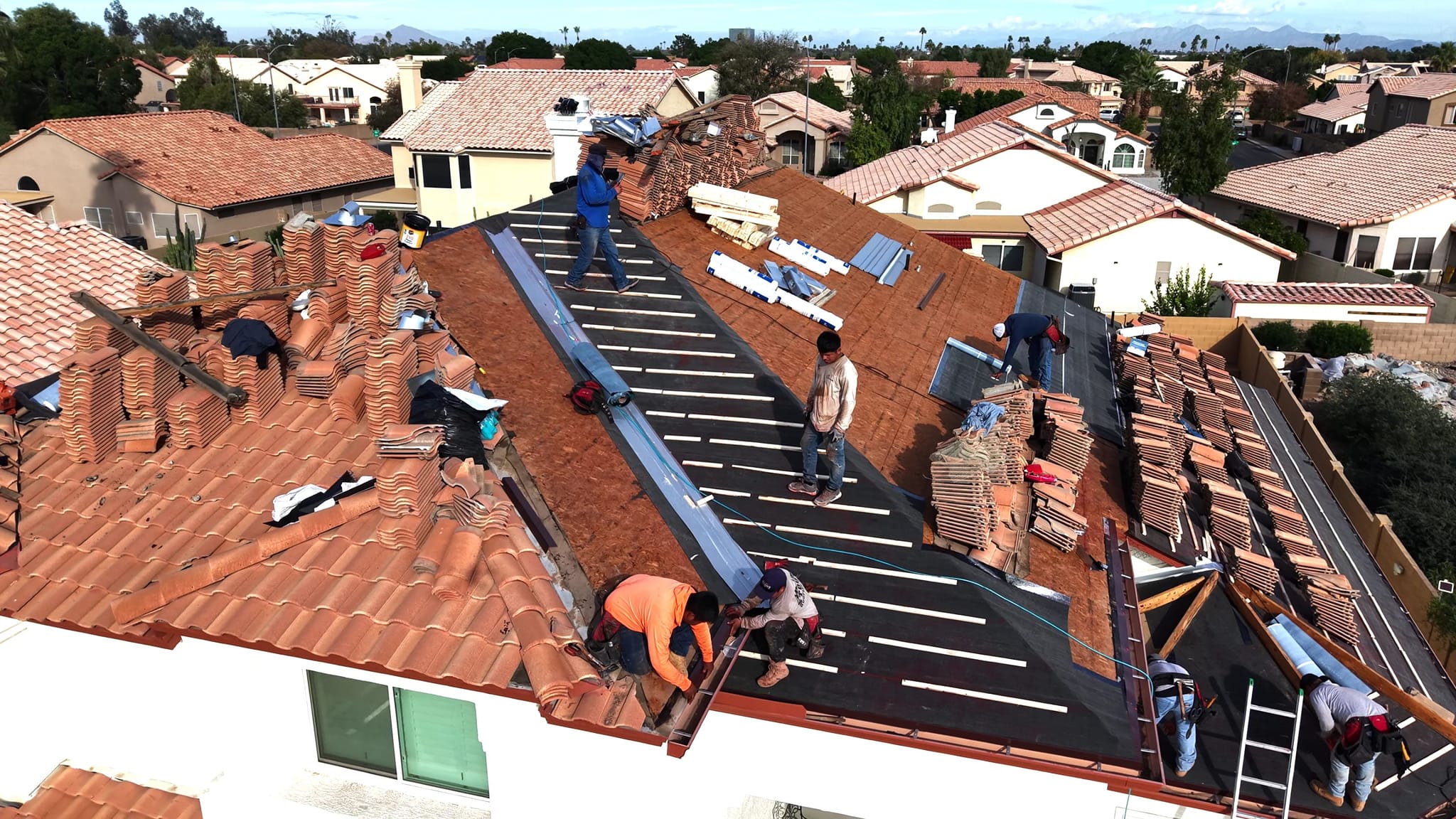 Vero Exteriors crew completing a tile roof replacement on a Phoenix area home